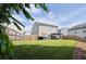 Large, fenced backyard with grass, a patio, dining table, and seating under a pergola at 382 Winston Circle Cir, Canton, GA 30114