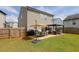 Large, fenced backyard with a patio area, perfect for outdoor dining and entertaining guests at 382 Winston Circle Cir, Canton, GA 30114