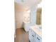 Bright bathroom features double vanity, white cabinets, and a tiled floor at 382 Winston Circle Cir, Canton, GA 30114
