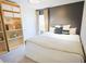 Comfortable bedroom featuring neutral tones, decorative pillows, and closet shelving at 382 Winston Circle Cir, Canton, GA 30114