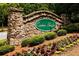 Welcome to Canton Heights, a beautiful community marked by a decorative stone entrance sign amid lush landscaping at 382 Winston Circle Cir, Canton, GA 30114