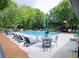 Relaxing community pool area with ample seating and shaded spots for residents to enjoy at 382 Winston Circle Cir, Canton, GA 30114