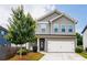 Charming two-story home with a well-maintained front yard and attached two-car garage at 382 Winston Circle Cir, Canton, GA 30114