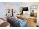 Spacious living area with natural light, modern furnishings, and seamless flow to other living spaces at 382 Winston Circle Cir, Canton, GA 30114