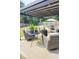 Outdoor patio includes comfortable seating, a fire pit, and a shaded pergola with string lights at 382 Winston Circle Cir, Canton, GA 30114