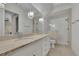Bright bathroom with elegant fixtures, large vanity, and glass-enclosed shower at 710 Cox Rd, Roswell, GA 30075