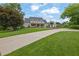 Beautiful home with a sprawling front lawn and a long driveway leading to a welcoming entrance at 710 Cox Rd, Roswell, GA 30075