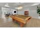 Spacious game room with a billiards table, comfortable seating area, and modern lighting at 710 Cox Rd, Roswell, GA 30075