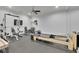 Modern home gym equipped with weightlifting equipment, weights and television at 710 Cox Rd, Roswell, GA 30075