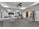 Bright home gym featuring modern equipment, mirrored wall, and ceiling fan at 710 Cox Rd, Roswell, GA 30075