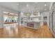 Spacious kitchen with a large island, pendant lighting, and a view into the dining area at 710 Cox Rd, Roswell, GA 30075