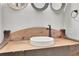 Unique powder room with a rustic wooden vanity and vessel sink at 710 Cox Rd, Roswell, GA 30075