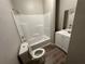 Bathroom features a shower, toilet, mirror, and a vanity with a sink at 8 Hazel St, Porterdale, GA 30014