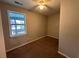 Cozy bedroom with a ceiling fan, a window offering natural light, and carpeted floors at 8 Hazel St, Porterdale, GA 30014