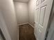 This walk-in closet features a carpeted floor and a white door at 8 Hazel St, Porterdale, GA 30014