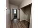 Hallway with modern flooring, open doorway, and laundry hookups at 8 Hazel St, Porterdale, GA 30014