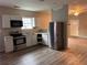 Renovated kitchen features stainless appliances and sleek modern design at 8 Hazel St, Porterdale, GA 30014