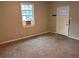 Cozy living room with neutral carpet and freshly painted walls at 8 Hazel St, Porterdale, GA 30014