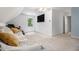 Bedroom featuring a white walls, carpeted floors, and a comfortable sofa with accent pillows at 8255 Habersham Waters Rd, Atlanta, GA 30350