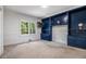Bedroom with blue built-ins and carpet flooring offers ample storage space and natural light at 8255 Habersham Waters Rd, Atlanta, GA 30350