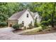 Beautiful home exterior showcasing a side view with a well-maintained lawn and lovely landscaping at 8255 Habersham Waters Rd, Atlanta, GA 30350