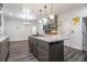Well-appointed kitchen with a center island, gas range, and stylish cabinetry offering ample storage at 8255 Habersham Waters Rd, Atlanta, GA 30350