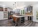 Modern kitchen featuring stainless steel appliances, a center island, and wine cooler offering convenience at 8255 Habersham Waters Rd, Atlanta, GA 30350