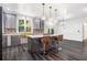 Contemporary kitchen featuring an island with seating, stainless steel appliances, and modern finishes at 8255 Habersham Waters Rd, Atlanta, GA 30350