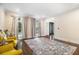 Bright living room featuring hardwood floors, neutral tones and natural light creating a serene space at 8255 Habersham Waters Rd, Atlanta, GA 30350