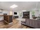 Spacious living room featuring hardwood floors, comfortable seating, and a cozy fireplace at 8255 Habersham Waters Rd, Atlanta, GA 30350