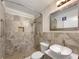 Modern bathroom with tiled shower, sleek vanity, and contemporary fixtures at 145 Washington St, Mcdonough, GA 30253