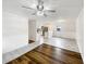 Open-concept living room with tile floors and modern ceiling fan at 145 Washington St, Mcdonough, GA 30253