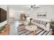 Staged living room featuring neutral colors, modern decor, and ample natural light at 145 Washington St, Mcdonough, GA 30253