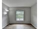 This bright bedroom features sleek wood flooring, neutral walls, and natural light at 3650 Ashford Dunwoody Rd, Ne, #923 # 923, Atlanta, GA 30319
