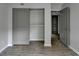 Bedroom featuring wood floors, closet, and an open doorway to the rest of the home at 3650 Ashford Dunwoody Rd, Ne, #923 # 923, Atlanta, GA 30319