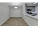 Open concept dining and kitchen featuring quartz countertops and stainless appliances at 3650 Ashford Dunwoody Rd, Ne, #923 # 923, Atlanta, GA 30319