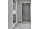 Inviting hallway featuring modern gray tones and durable wood-look flooring at 3650 Ashford Dunwoody Rd, Ne, #923 # 923, Atlanta, GA 30319