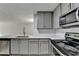 Kitchen featuring stainless steel appliances, stone countertops, and light gray cabinets at 3650 Ashford Dunwoody Rd, Ne, #923 # 923, Atlanta, GA 30319