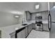 Kitchen featuring stainless steel appliances, stone countertops, and modern sink at 3650 Ashford Dunwoody Rd, Ne, #923 # 923, Atlanta, GA 30319