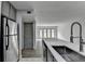 Kitchen featuring stainless steel appliances, stone countertops, sink, and modern cabinets at 3650 Ashford Dunwoody Rd, Ne, #923 # 923, Atlanta, GA 30319