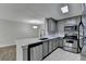 Kitchen featuring stainless steel appliances, stone countertops, and light gray cabinets at 3650 Ashford Dunwoody Rd, Ne, #923 # 923, Atlanta, GA 30319