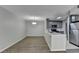 Open living and kitchen area with stainless steel appliances and modern lighting at 3650 Ashford Dunwoody Rd, Ne, #923 # 923, Atlanta, GA 30319