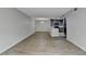 Spacious living area with dark kitchen cabinets and durable modern floors at 3650 Ashford Dunwoody Rd, Ne, #923 # 923, Atlanta, GA 30319