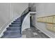 Elegant curved staircase with wrought iron railing and stylish tiled floor at 3650 Ashford Dunwoody Rd, Ne, #923 # 923, Atlanta, GA 30319