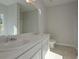 Bathroom featuring double sinks with a large mirror, vanity and cabinet storage space at 490 Charleston Pl, Villa Rica, GA 30180