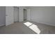 This bedroom features neutral walls, carpet flooring, and a walk-in closet at 490 Charleston Pl, Villa Rica, GA 30180
