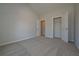 This bedroom features neutral walls, carpet flooring, and a walk-in closet at 490 Charleston Pl, Villa Rica, GA 30180
