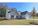 View of a cozy home featuring a two-car garage and a well-maintained lawn at 490 Charleston Pl, Villa Rica, GA 30180