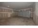 Unfinished garage features concrete floors and drywall on walls at 490 Charleston Pl, Villa Rica, GA 30180