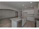 Bright kitchen featuring granite countertops, stainless appliances, and breakfast bar at 490 Charleston Pl, Villa Rica, GA 30180